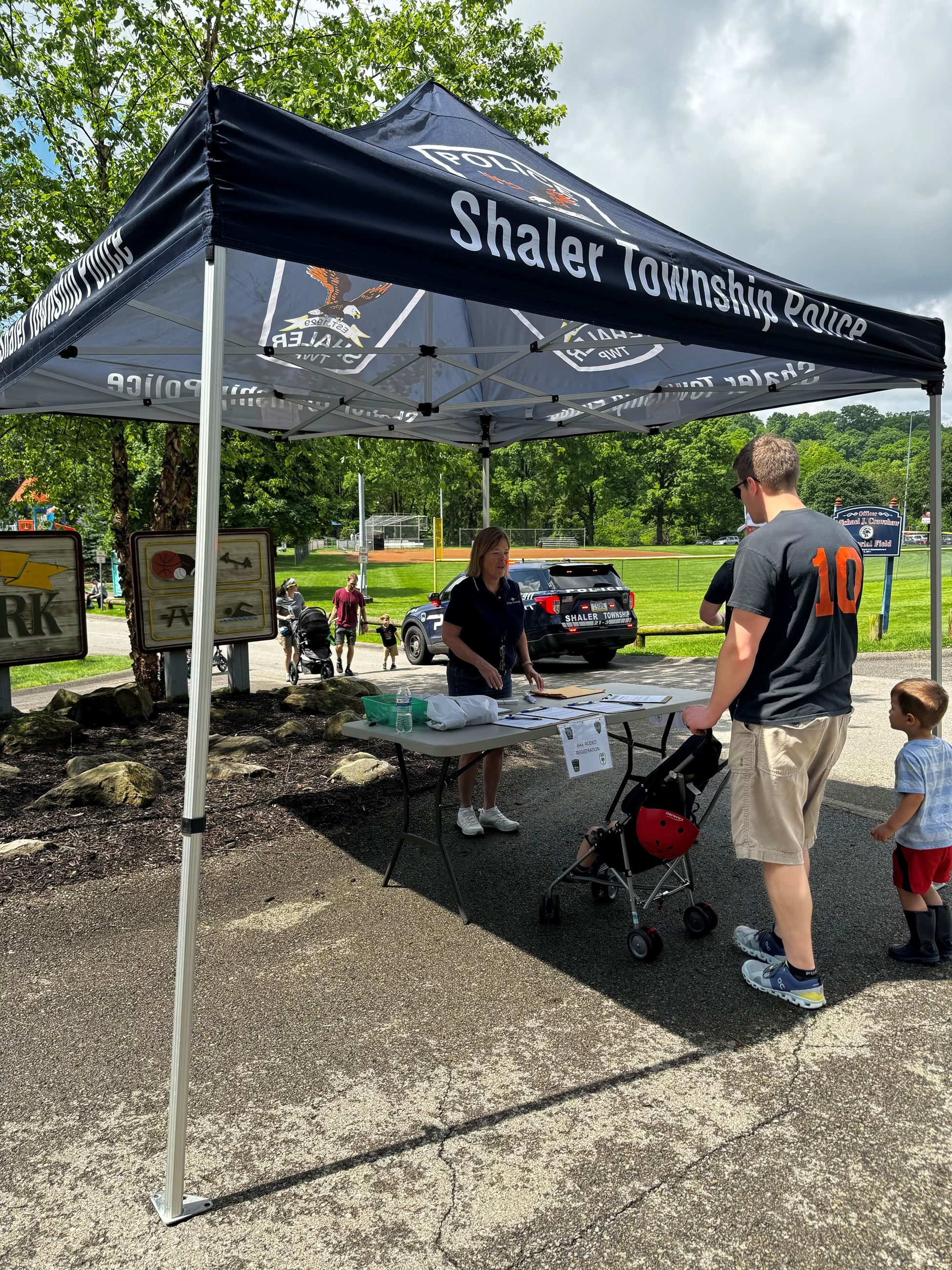 Father and son checking in at the Bike Rodeo